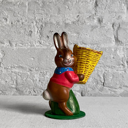 john derian Papier Mâché Bunny with Yellow Basket Add to cart Details 2.75" W x 5.5" H Painted papier-mâché Each item will feature unique variations Handmade in Germany   Based in Germany and family owned since 1894 Ino Sc