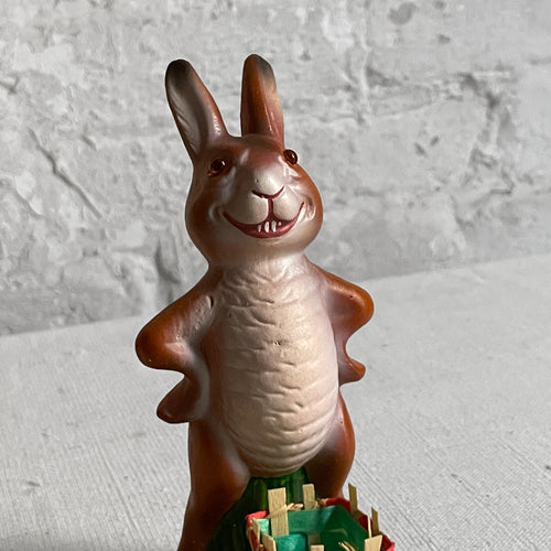 John Derian Papier Mâché Upright Bunny With Green Basket Add To Cart Details 3.5" W X 6" H Painted Papier-mâché Glitter And Straw Each Item Will Feature Unique Variations Handmade in Germany   Based In Germany And Family O
