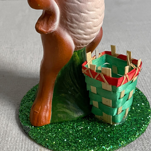 John Derian Papier Mâché Upright Bunny With Green Basket Add To Cart Details 3.5" W X 6" H Painted Papier-mâché Glitter And Straw Each Item Will Feature Unique Variations Handmade in Germany   Based In Germany And Family O
