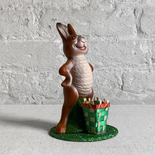 john derian Papier Mâché Upright Bunny with Green Basket Add to cart Details 3.5" W x 6" H Painted papier-mâché glitter and straw Each item will feature unique variations Handmade in Germany   Based in Germany and family o