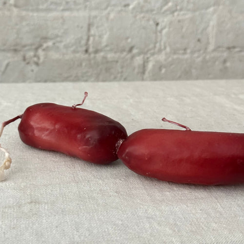 John Derian Sausage Link Candle Add To Cart Details 19" L X 1.5" W X 2" H Paraffin Wax Each Item Will Feature Unique Variations Made In Italy Care Remove All Paper Before Burning. Not Intended For Children.   Cereria Introna Ha