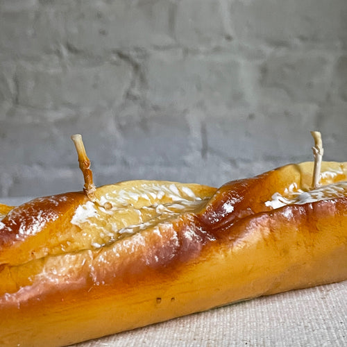 John Derian Short Sfilatino Baguette Candle Add To Cart Details 10" L X 2" W Paraffin Wax Each Item Will Feature Unique Variations Made In Italy Care Remove All Paper Before Burning. Not Intended For Children.   Cereria Introna
