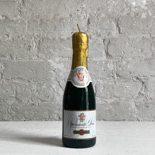 john derian Small Spumante Sparkling Wine Bottle Candle Add to cart Details  8” H Paraffin Wax Each item will feature unique variations Made in Italy Care Remove All Paper Before Burning. Not intended for children.   Cereria