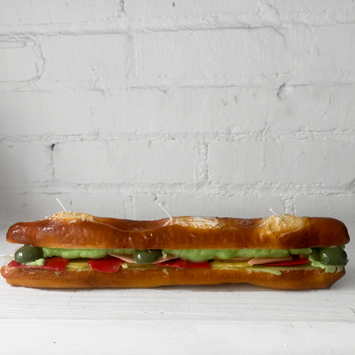 John Derian Stuffed Baguette Sandwich Candle Add To Cart Details 13" L X 2.5" W X 2.25" H Paraffin Wax Each Item Will Feature Unique Variations Made In Italy Care Remove All Paper Before Burning. Not Intended For Children. Cerer