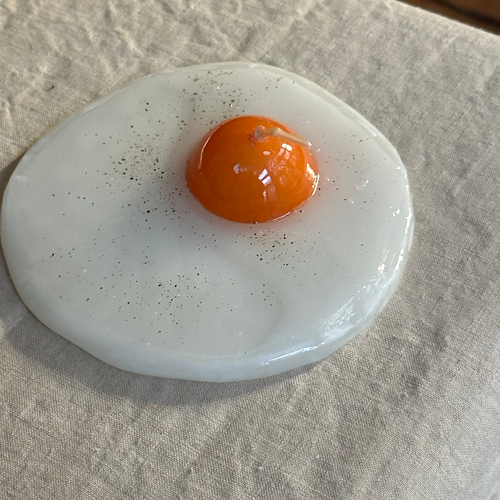 John Derian Uovo Fried Egg Candle Add To Cart Details 5.5" L X .75" H Paraffin Wax Each Item Will Feature Unique Variations Made In Italy Care Remove All Paper Before Burning. Not Intended For Children.   Cereria Introna Has B