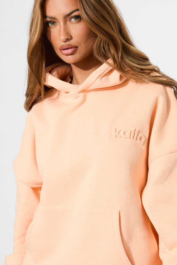 Kaiia Embossed Logo Oversized Hoodie Orange Sherbet