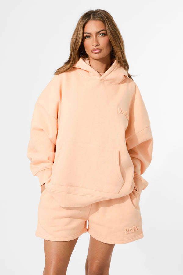Kaiia Embossed Logo Oversized Hoodie Orange Sherbet