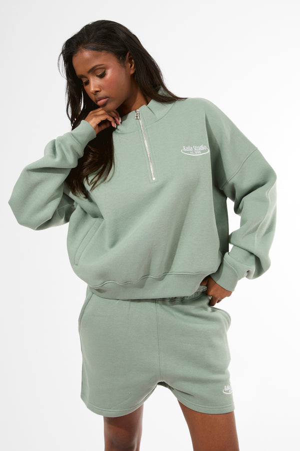 Kaiia Running Club Logo Quarter Zip Sweatshirt Green Tea