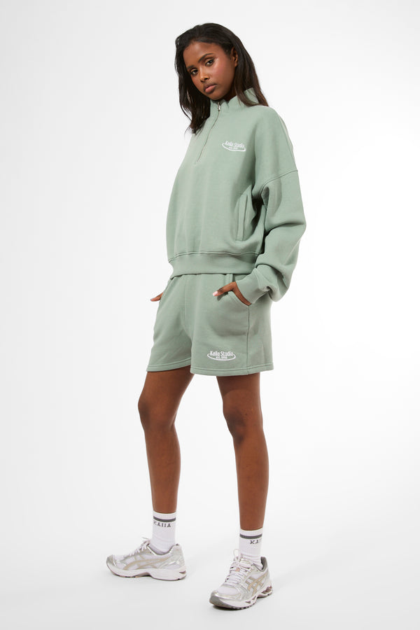 Kaiia Running Club Logo Quarter Zip Sweatshirt Green Tea