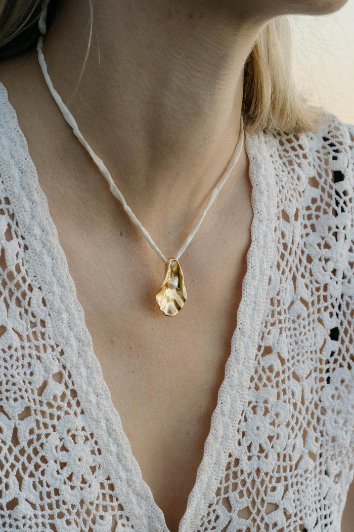 kara yoo jewelry Oyster Shell Necklace on Raw Silk