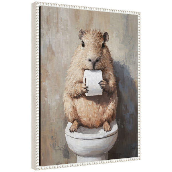 kate & laurel Sylvie Capybara Holding Toilet Paper Roll Toilet Bathroom Art Framed Canvas by The Creative Bunch Studio