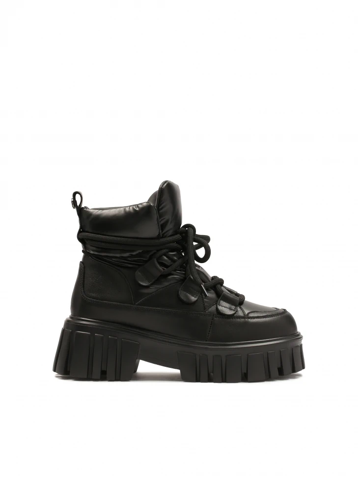 kazar Black boots on a massive sole with a soft upper