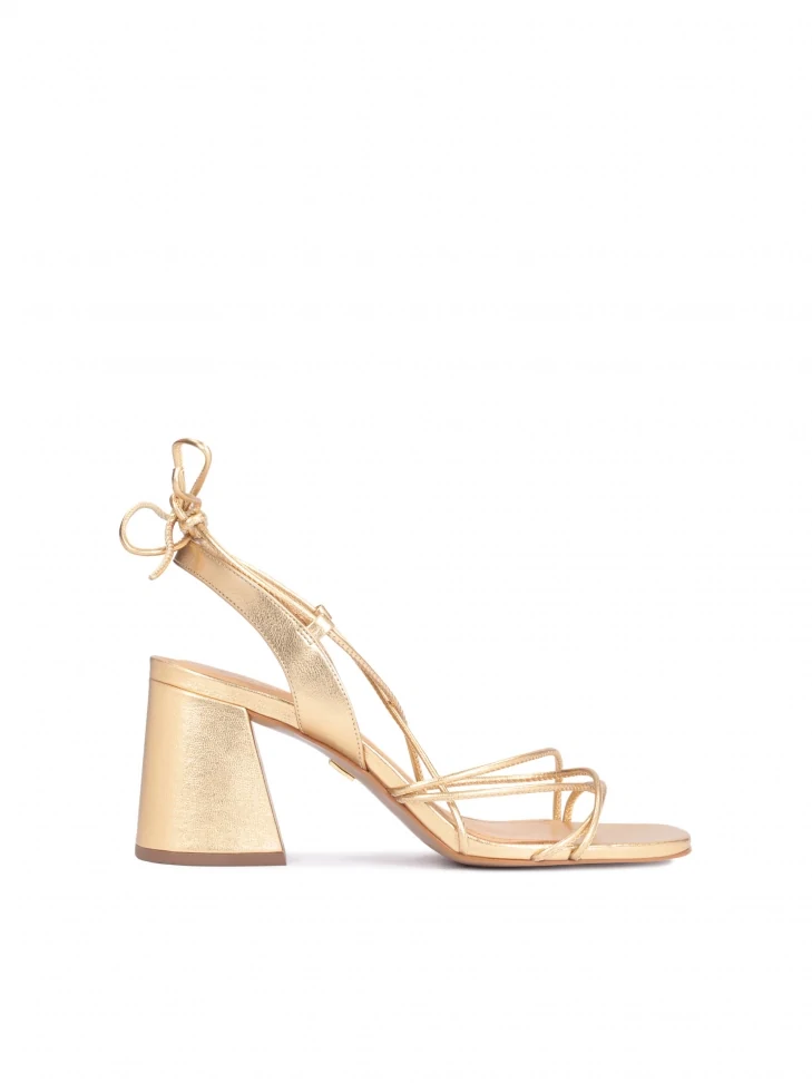 kazar Golden sandals on a block heel laced around the calf