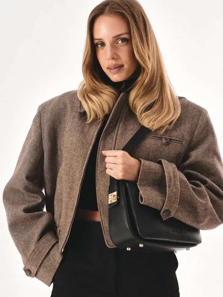 Kazar Black Handbag With Striking Pinned Strap