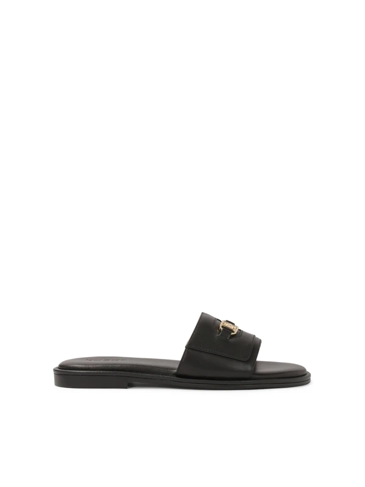 kazar Black monogrammed slides on a flat sole