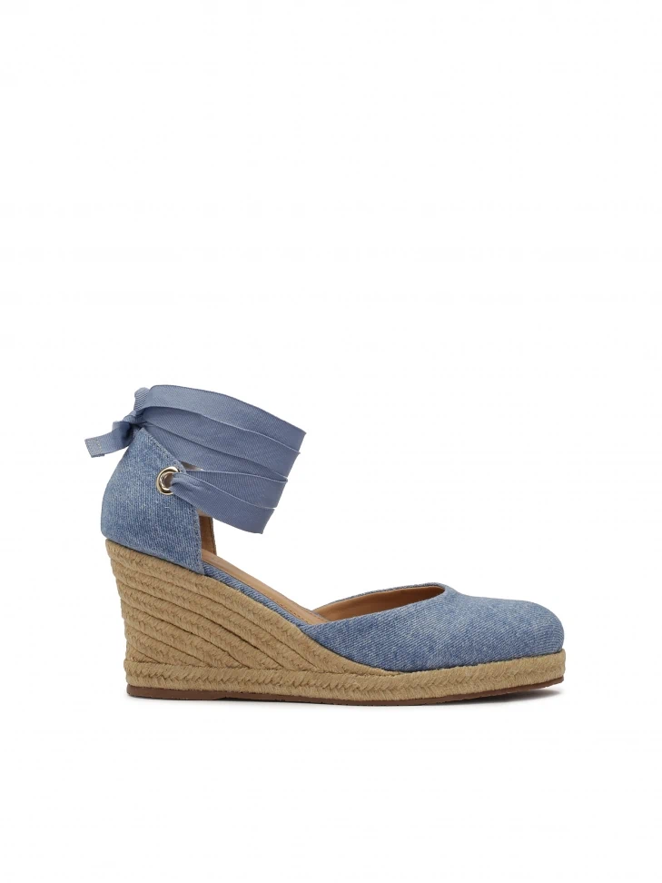 kazar Blue knotted sandals on a platform heel