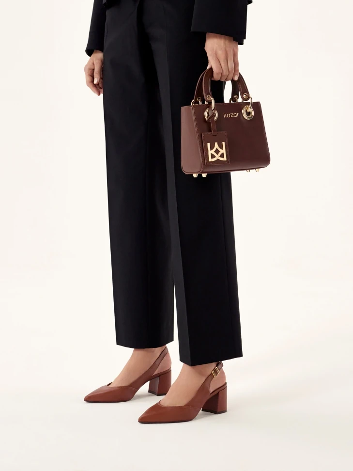 Kazar Brown Pumps On A Post With An Open Heel