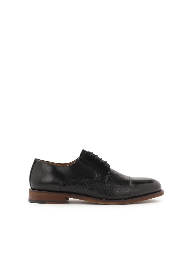 kazar Classic black shoes on a brown sole