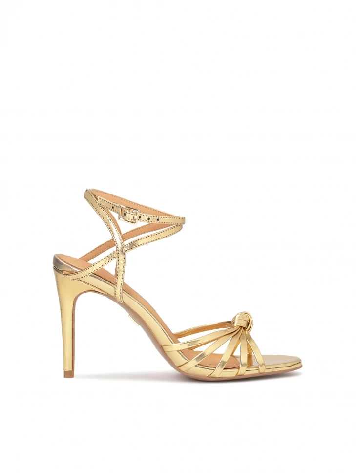 kazar Elegant golden sandals with angled straps
