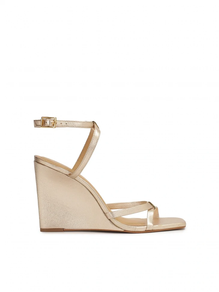kazar Gold sandals on a platform