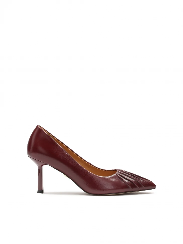 kazar Maroon pumps with a striking notch on the nose