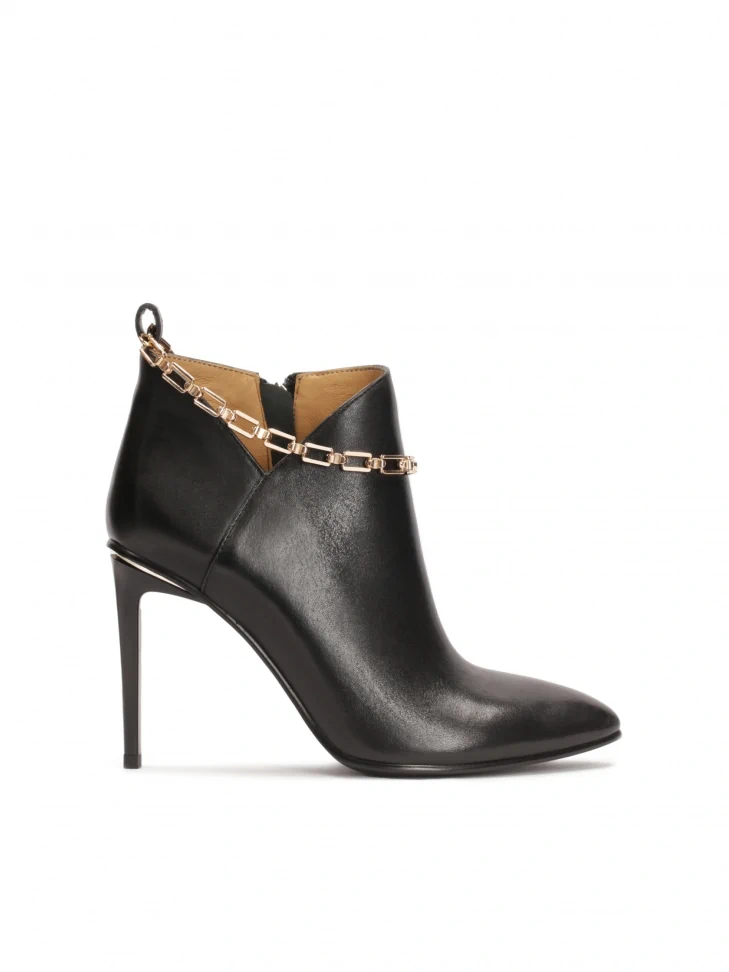 kazar Phenomenal boots on a slender stiletto heel with a striking chain at the ankle