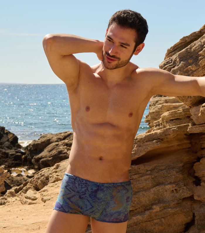 kiniki Azure Tan Through Swim Trunks