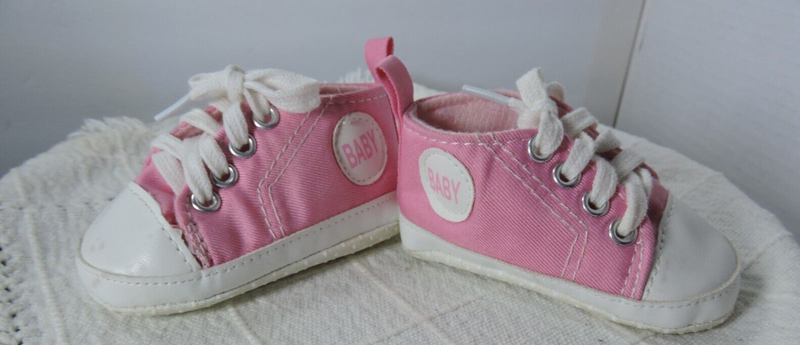 Pink Baby Shoes look like canvas shoes says baby on side size 11