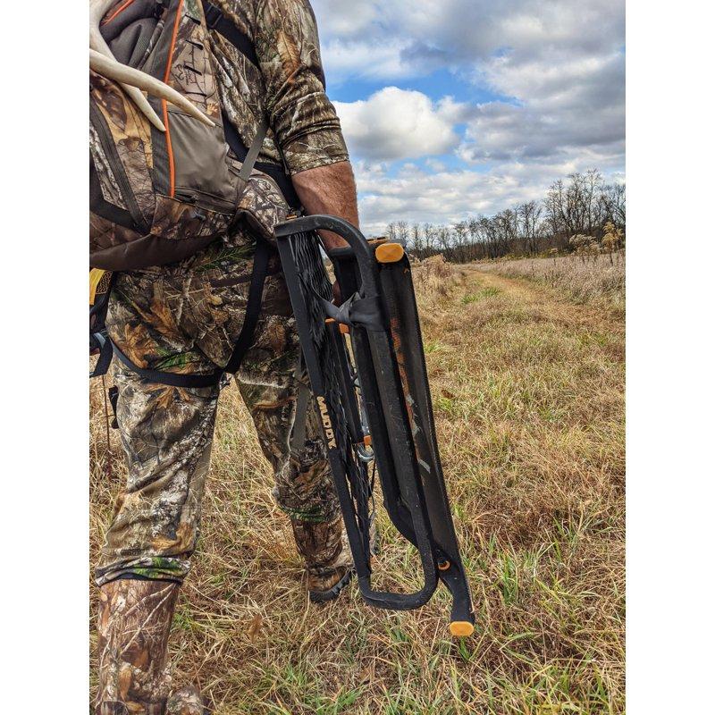 MUDDY Boss XL Hang-on Durable Weather-Resistant Outdoor Hunting Tree Stand Wide Stance Platform With Fixed Footrest & Flip-Back Flex-Tek Seat 300 Pound Maximum Capacity