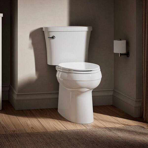KOHLER Gleam 12 In. Rough In 2-Piece 1.28 GFP Single Flush Elongated Chair Height Toilet In White With Soft Close Seat