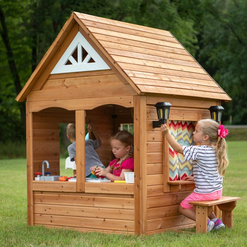 Wayfair Backyard Discovery Aspen Cedar Wooden Kids Playhouse With Play Kitchen Snack Bar Window And Picnic Bench