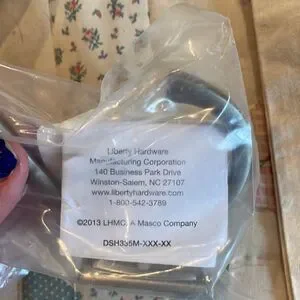 4 Unopened towel hooks from Lowes brushed nickel