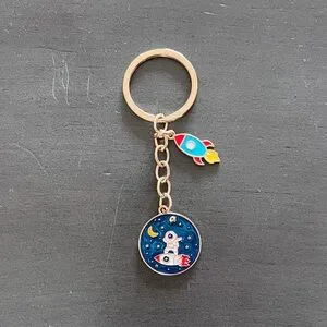 Astronaut Riding Surfing Rocket Spaceship Yellow Star Enamel 3.5" Gold Keychain