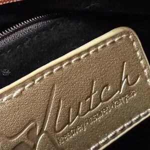 Chic Black And Tan Clutch With Snakeskin Accent