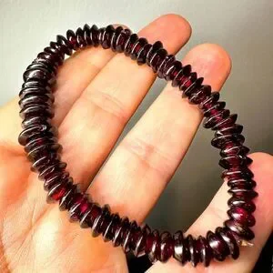 Genuine graduated garnet disk beaded stretchy bracelet