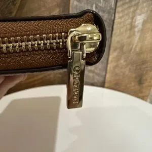 New Orton Brown Pebbled Leather Zip Around Wallet With Embossed Logo 16 Card