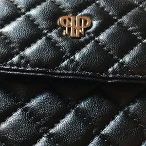 ^ NWT Chico’s Quilted Black Clutch