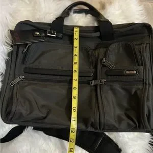 Tumi Black Laptop Bag With Detachable Strap And Professional Design