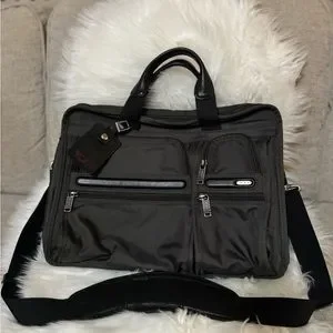 Tumi Black Laptop Bag with Detachable Strap and Professional Design
