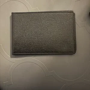 Vintage black Louis Vuitton passport holders