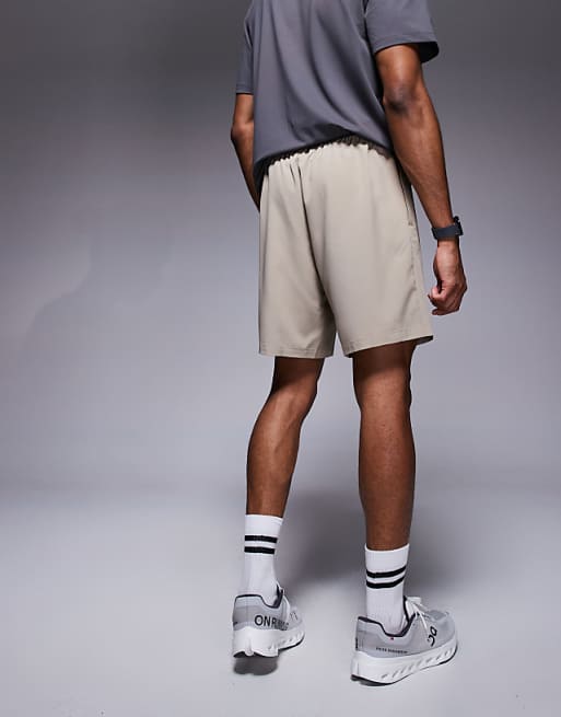 4505 Icon 7 Inch Quick Dry Training Shorts With Zip Pockets In Stone