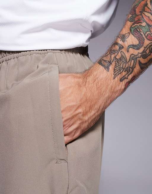 4505 Icon 7 Inch Quick Dry Training Shorts With Zip Pockets In Stone Grey