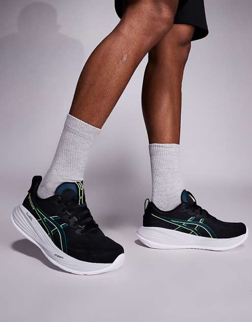 Asics Gel-Cumulus 27 running trainers in black and lucid yellow