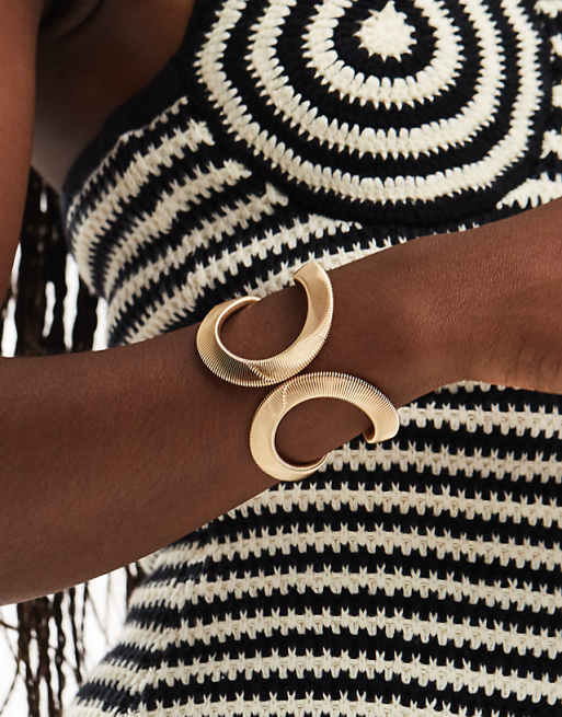 ASOS DESIGN bangle bracelet with curved textured chain detail in gold tone