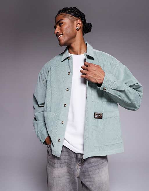 ASOS DESIGN boxy oversized cord shirt with badge detail in green