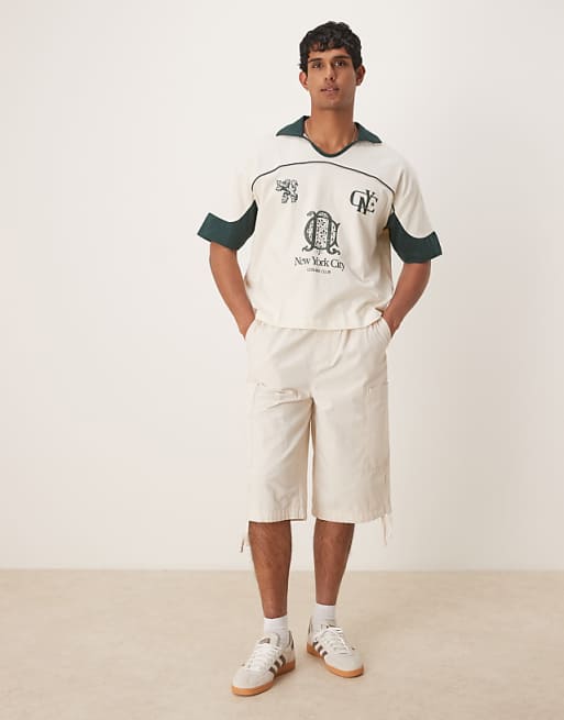ASOS DESIGN Boxy Oversized Polo With Cut And Sew Panelling And City Graphics In Cream
