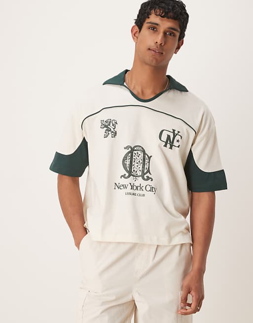 ASOS DESIGN boxy oversized polo with cut and sew panelling and city graphics in cream