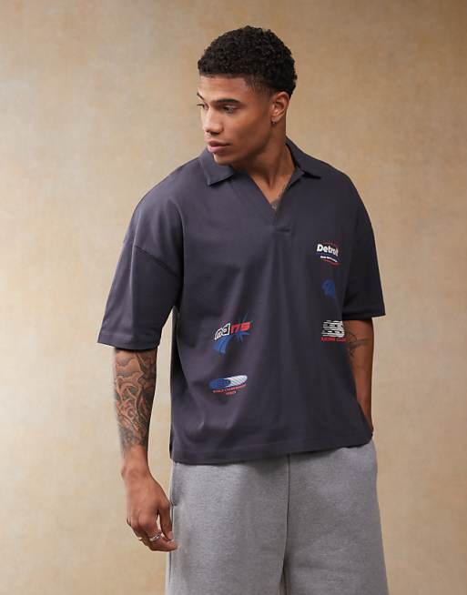ASOS DESIGN boxy oversized polo with dropped shoulder and multiplacement sport print in navy