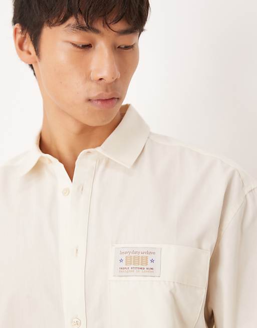 ASOS DESIGN Boxy Oversized Shirt With Chest Badge In Cream