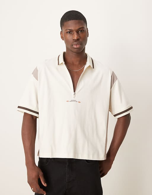 ASOS DESIGN Boxy Oversized Zipped Polo With Cut And Sew Panelling And Text Graphic In Cream
